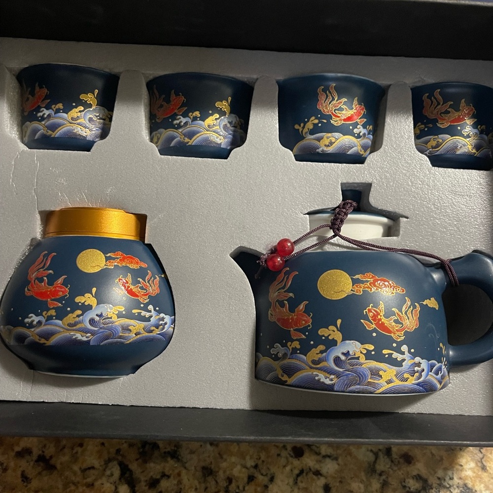 Elegant Blue Tea Set with Goldfish Design